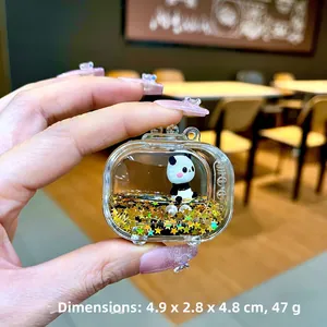 Macro detail of acrylic panda television charm with golden stars and liquid inside