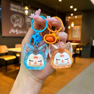 Porte-clés renard mignon en acrylique avec paillettes et breloques en bleu et orange