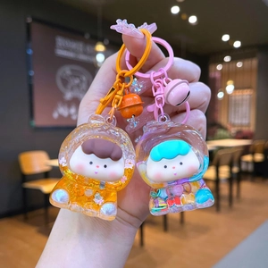 Cute astronaut liquid quicksand keychain with colorful bells for bag decoration
