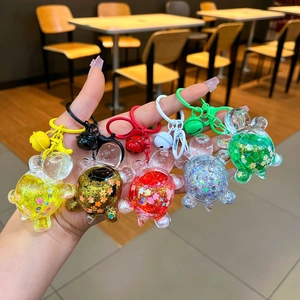 Group of colorful turtle keychains with glitter filling and matching bells