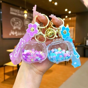 Luminous Sakura TV shaker keychain with colorful beads and silicone strap in pink and blue