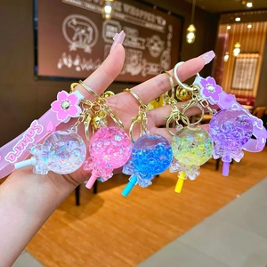 Five assorted lollipop oil-filled acrylic keychains with floating glitter and Sakura straps