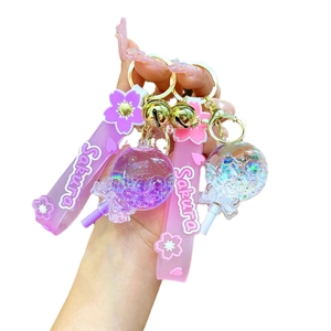 Pink and purple Sakura acrylic liquid glitter keychain with PVC strap and bell