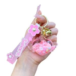Pink heart keychain with sakura silicone wrist strap and golden bell charm for bags
