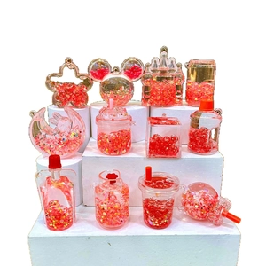 Porte-clés de sable mouvant violet lumineux avec paillettes d'étoiles dorées et château