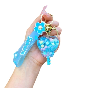 Blue acrylic heart keychain with oil sand, Sakura wrist strap and golden bell charm