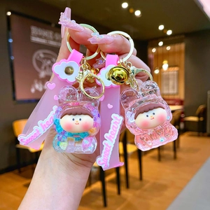 Detail of Lilith quicksand keychain with pink silicone strap and acrylic rabbit shell