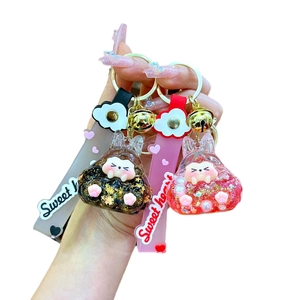 Porte-clés lumineux en acrylique avec figurines en résine et dragonne en silicone