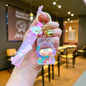 Detail of pink silicone wristband with Sweet heart text and glittery rabbit girl pendant
