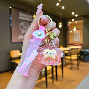 Detailed view of a pink glitter liquid keychain featuring a cute pig and Sweet heart strap