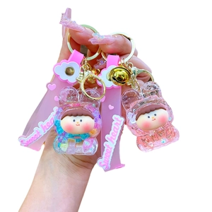 Cute acrylic liquid sand keychain with bear hoodie doll and pink silicone wrist strap