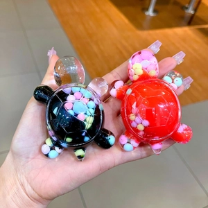 Quicksand turtle keychains with macaron beads in red and black transparent shells