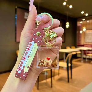 Capybara liquid quicksand keychain with brown strap and milk tea bubble tea theme