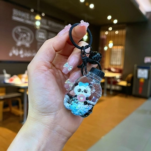 Porte-clés panda avec liquide et panda flottant dans une bouteille en acrylique
