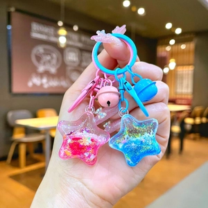 Star-shaped liquid glitter keychain with colorful sequins and pastel bow accessories