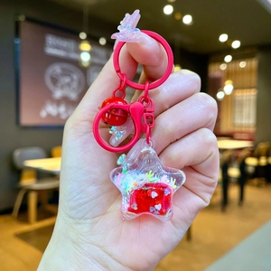 Star-shaped liquid glitter keychain with red quicksand and heart sequins detail