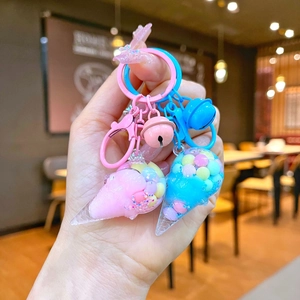 Detail of pink and blue ice cream cone keychains with glitters and colorful beads