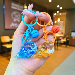 Creative liquid glitter ice cream cone keychains with stars and moons in blue and orange