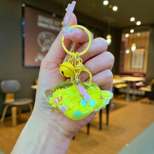 Handheld luminous heart keychain with yellow wings, dried flowers and gold bell