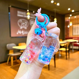 Luminous drift bottle keychain with liquid quicksand and colorful stars for schoolbags
