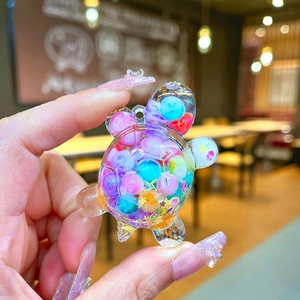 Acrylic transparent mini turtle figurine filled with colorful quicksand beads for decor