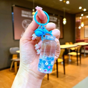 Blue drifting bottle keychain with luminous bubbles, liquid quicksand and small bell charm
