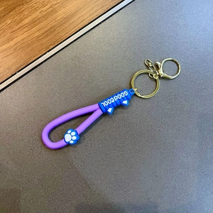 Porte-clés patte de chat mignon avec oreilles en silicone bleu et lanière violette