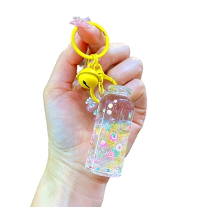 Luminous drift bottle keychain with liquid, colorful glitter and yellow metal bell