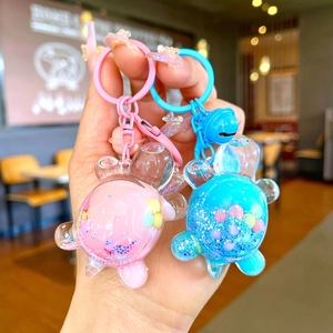 Bunte Schildkröte Schlüsselanhänger mit flüssigem Treibsand und rosa blauen Glocken