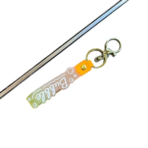 Tricolor gradient silicone keychain with Bubble text and gold lobster clasp on white background