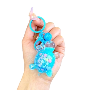 Kreativer Schildkröten-Schlüsselanhänger mit blauem Treibsand und Glitzereffekt-Zubehör