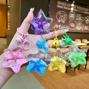 Starfish acrylic oil-filled liquid sand keychain with shells and bells in five vibrant colors
