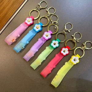 Set of six colorful silicone flower keychains with gold metal rings and lobster clasps