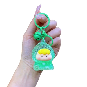 Porte-clés acrylique sablier fille aux fruits avec figurine verte et clochette assortie