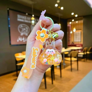 Luminous creative bunny keychain with liquid quicksand glitter and Sakura silicone strap