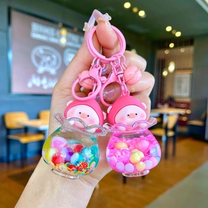 Luminous snowflake peach pig liquid quicksand bottle keychain with fruit charms