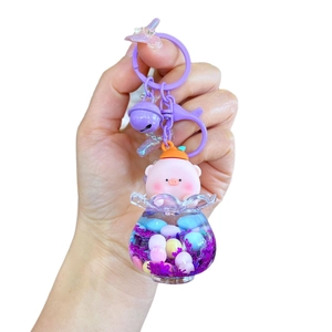 Luminous snowflake peach pig liquid quicksand bottle keychain with purple bell and hook