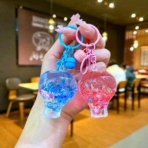 Luminous hot air balloon liquid keychains with colorful beads and matching bells