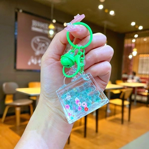 Detailed view of creative luminous bag keychain with colorful beads and sakura stickers