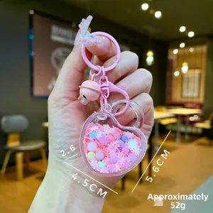 Pink heart quicksand keychain detail with glitter flakes and size 4.5x5.6cm