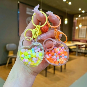 Luminous heart liquid sand keychain with glitters, sequins and bell for women and girls