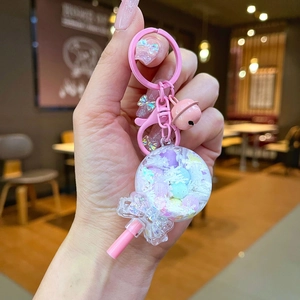 Pink heart-shaped lollipop keychain with acrylic oil sand and colorful beads inside