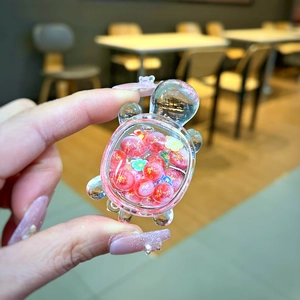 Glittery pink turtle resin figurine with sand-like particles for DIY crafts