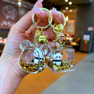 Acrylic panda liquid keychain with golden star sequins and floating panda charms