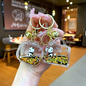 Acrylic oil-filled panda liquid keychain with gold stars and cute 3D panda figure