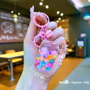Detailed view of a mini drink can keychain with colorful beads and 5cm height dimensions
