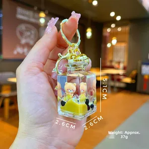Detailed view of bubble tea liquid bear keychain with yellow oil and acrylic bottle