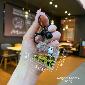 Detail view of cartoon panda liquid quicksand keychain with star sequins and dimensions