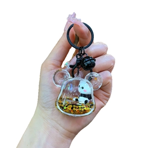 Cartoon panda liquid quicksand keychain with gold star sequins and black metal bell