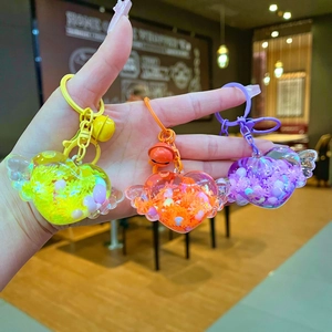 Luminous heart wings liquid sand keychains in yellow, orange and purple variants